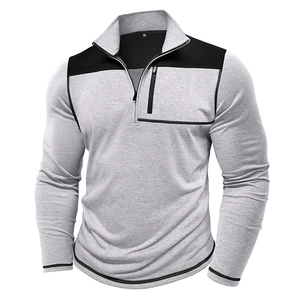 Detail of grey quarter-zip pullover showing black contrast collar and chest zipper pocket