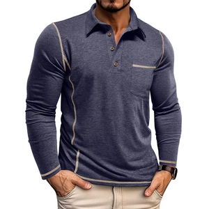 Detail of grey polo shirt featuring wood-style buttons, chest pocket, and contrast stitching