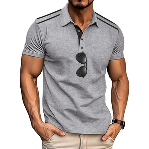 Close-up of a men's polo shirt with grey contrast placket and black shoulder stripes