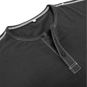 Detail of black Henley shirt neckline with contrast white stitching and XL size tag