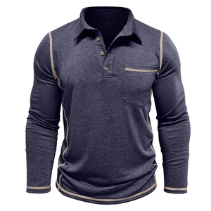 Close-up of contrast beige stitching on navy long sleeve polo shirt pocket and collar
