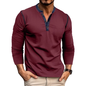 Detail shot of men's burgundy long sleeve Henley shirt with navy contrast stitching and buttons