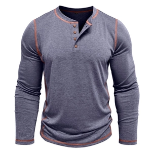 Detail of grey-blue long sleeve Henley shirt with orange contrast stitching and buttons