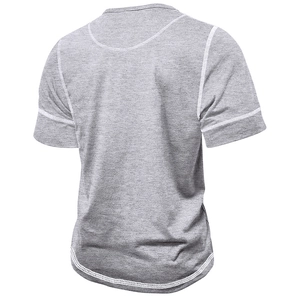 Detail view of grey muscle shirt with contrast white stitching on neck and sleeves