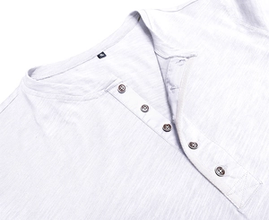 Close-up of slub texture fabric and button neckline on this white Henley shirt