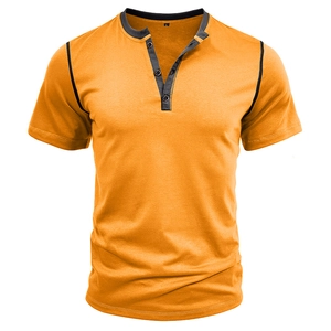 Detail of mustard yellow Henley t-shirt with grey contrast stitching and button collar