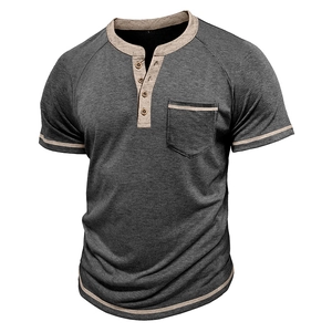 Detail of grey Henley shirt showing contrast beige trim on collar, pocket and sleeves