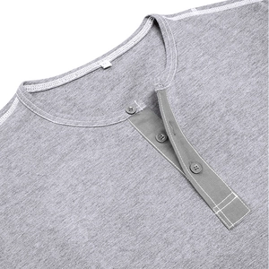 Detail of grey Henley shirt showing contrast stitching and three-button placket design