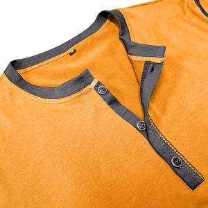 Detail of mustard yellow Henley shirt neckline with grey contrast placket and three buttons