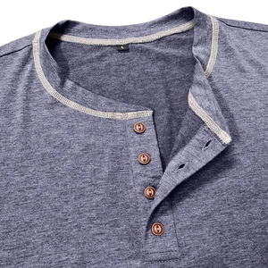 Macro detail of Henley neckline with four brown buttons and contrast stitching