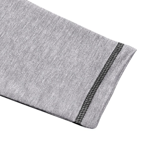 Macro detail of heather gray tactical sweatshirt sleeve with contrast black flatlock stitching