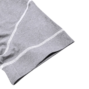 Macro shot of durable flatlock stitching on the grey heather knit men's Henley shirt sleeve
