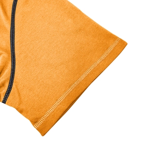 Detail of bright orange sports tee sleeve featuring black contrast stitching and hem