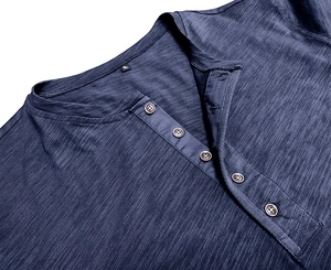 Close-up of navy blue muscle Henley shirt featuring five buttons and slub fabric texture