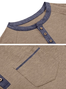 Detail of Henley shirt neckline with contrast buttons and stitched chest pocket