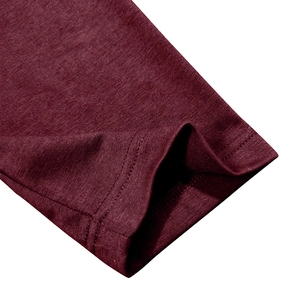 Detailed close-up of burgundy knit fabric texture and double-needle stitching on cuff