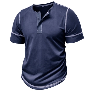 Detail of dark blue Henley shirt featuring white contrast stitching and buttoned neckline