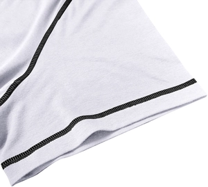Close-up of white Henley shirt sleeve with high-quality black contrast stitching detail