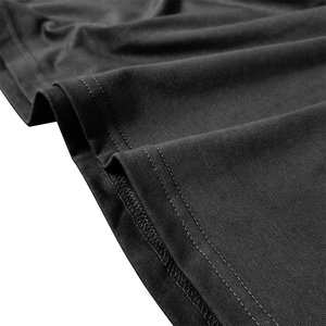 Detail of professional double-needle stitching and seam work on black polo shirt hem