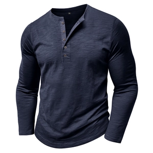Detail of dark blue men's Henley shirt showing slub texture and five-button neckline