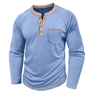 Detail of blue Henley shirt with khaki collar, chest pocket and raglan sleeves