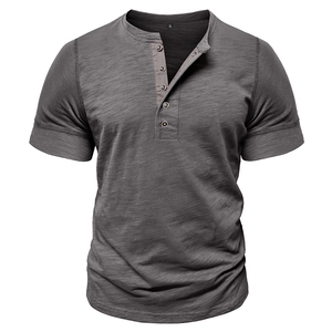 Detail of dark charcoal slub cotton texture and buttoned neckline of the men's Henley shirt