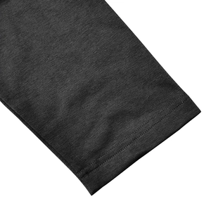 Detailed close-up of double-stitched hem on dark grey long sleeve men's polo shirt