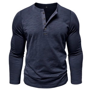 Detail of navy blue henley shirt featuring five-button placket and textured slub cotton fabric