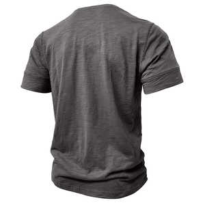 Macro view of men's muscle fit henley shirt featuring dark gray marl slub fabric texture