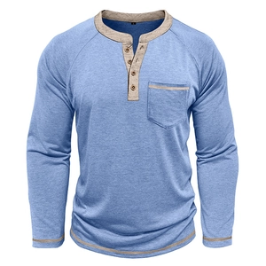 Detail of light blue Henley shirt featuring four wooden buttons and beige contrast trim
