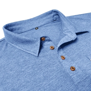 Close-up of blue polo shirt showing knit texture and four brown wood-grain buttons