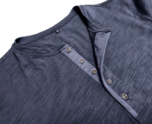 Close-up of dark navy Henley neck with five-button placket and slub cotton texture