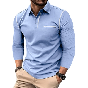 Detail of light blue long-sleeved polo shirt showing contrast stitching and chest pocket