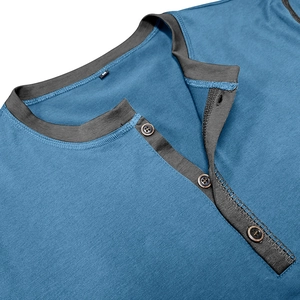 Close-up of contrast grey collar and brown buttons on navy blue cotton Henley shirt