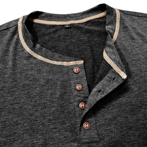 Macro shot of dark grey Henley shirt neckline with khaki trim and four brown buttons