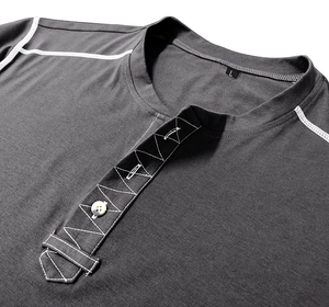 Detail of dark gray Henley shirt neckline featuring three buttons and white contrast stitching