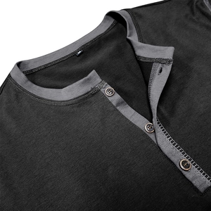 Detail of grey men's Henley shirt showing 3-button placket and knit fabric texture