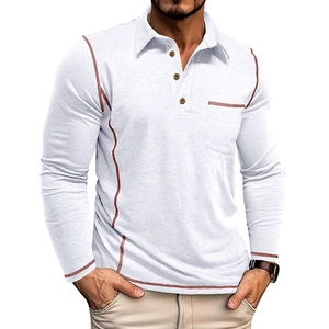 Detail of white long sleeve polo shirt showing brown contrast stitching and chest pocket