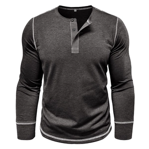 Detail view of charcoal grey Henley shirt with contrast white stitching and three-button placket