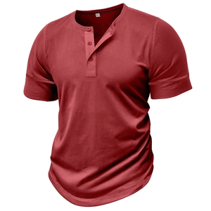 Detail of burgundy muscle fit Henley shirt featuring three-button placket and sleeve hems