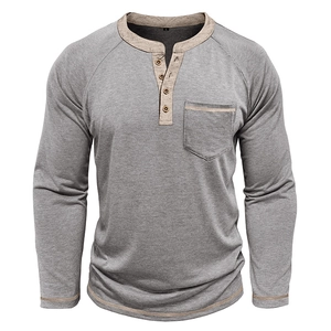 Macro detail of men's Henley shirt showing cotton texture and brown contrast stitching