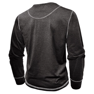 Detail of dark grey long sleeve Henley shirt featuring contrast white flatlock stitching