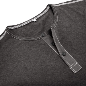 Detail of dark grey Henley shirt collar with three black buttons and white contrast stitching