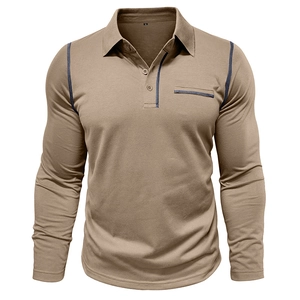 Detail of tan long sleeve polo shirt featuring navy contrast stitching and chest pocket