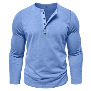 Detail view of light blue Henry neck shirt with textured fabric and five-button closure