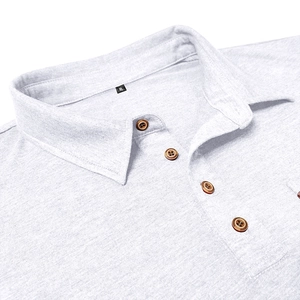 Detail view of light grey long sleeve Polo shirt with wooden buttons and knit texture