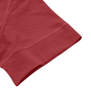 Close-up detail of dark red knit fabric showing premium double-needle flat stitching finish