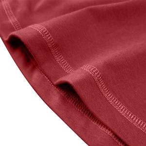 Detailed view of red cotton muscle shirt with high-quality double-stitched hem and seams