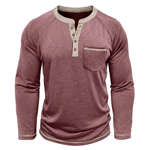 Detail of burgundy Henley shirt with grey raglan sleeves and four-button neckline