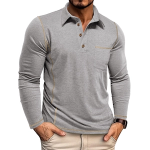 Detail of light grey long sleeve polo shirt showing contrast stitching and wood-textured buttons